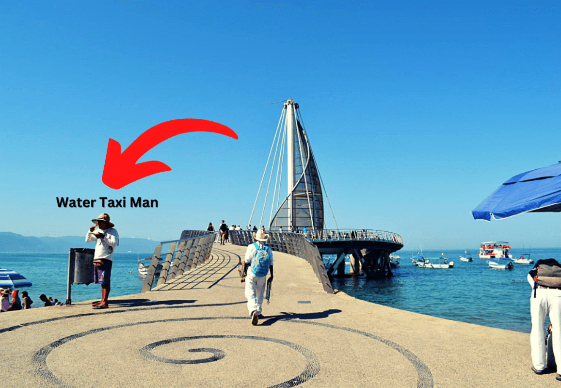 A water taxi man eating near the pier in Vallarta.