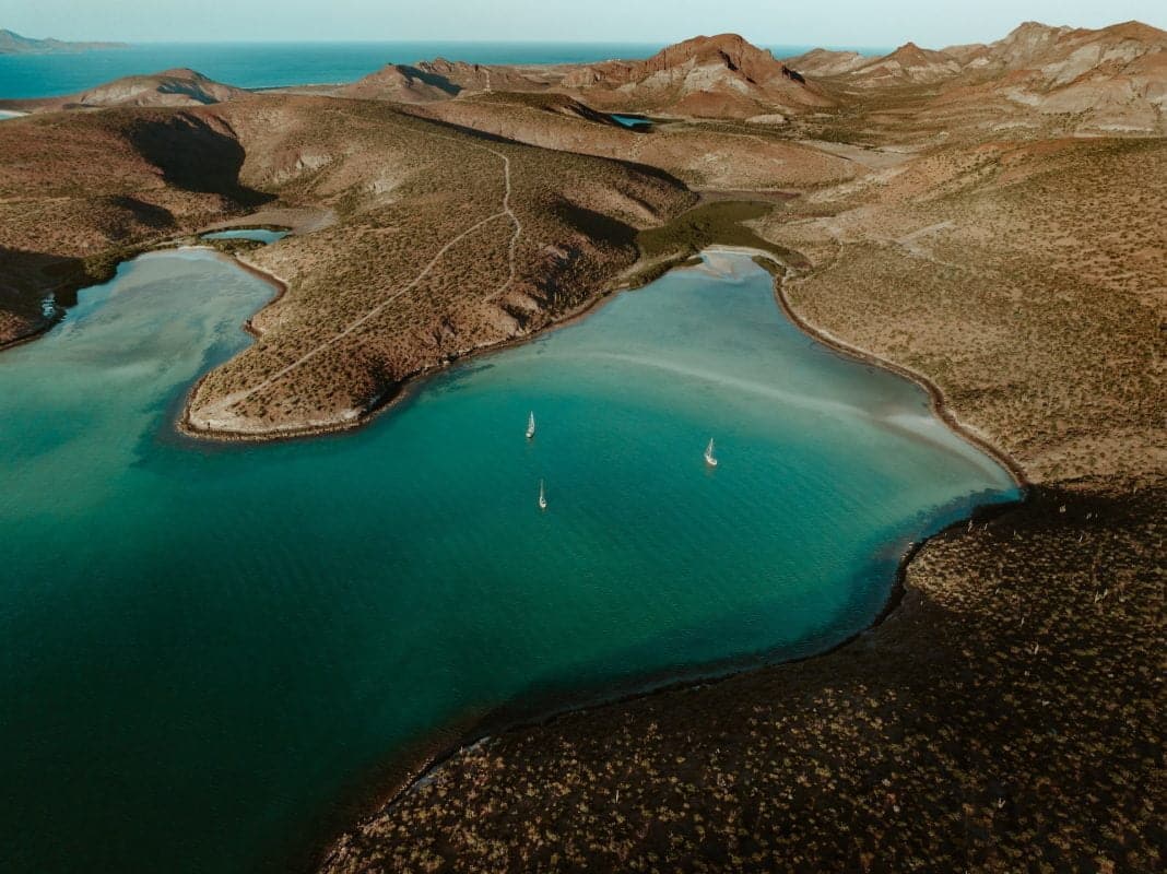 an aerial view of a beach in playa pichilingue la paz mexico