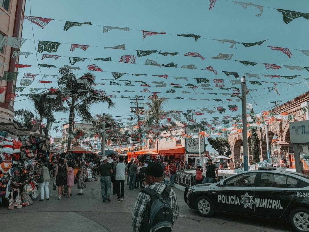 police car and people in Tijuana, Mexico